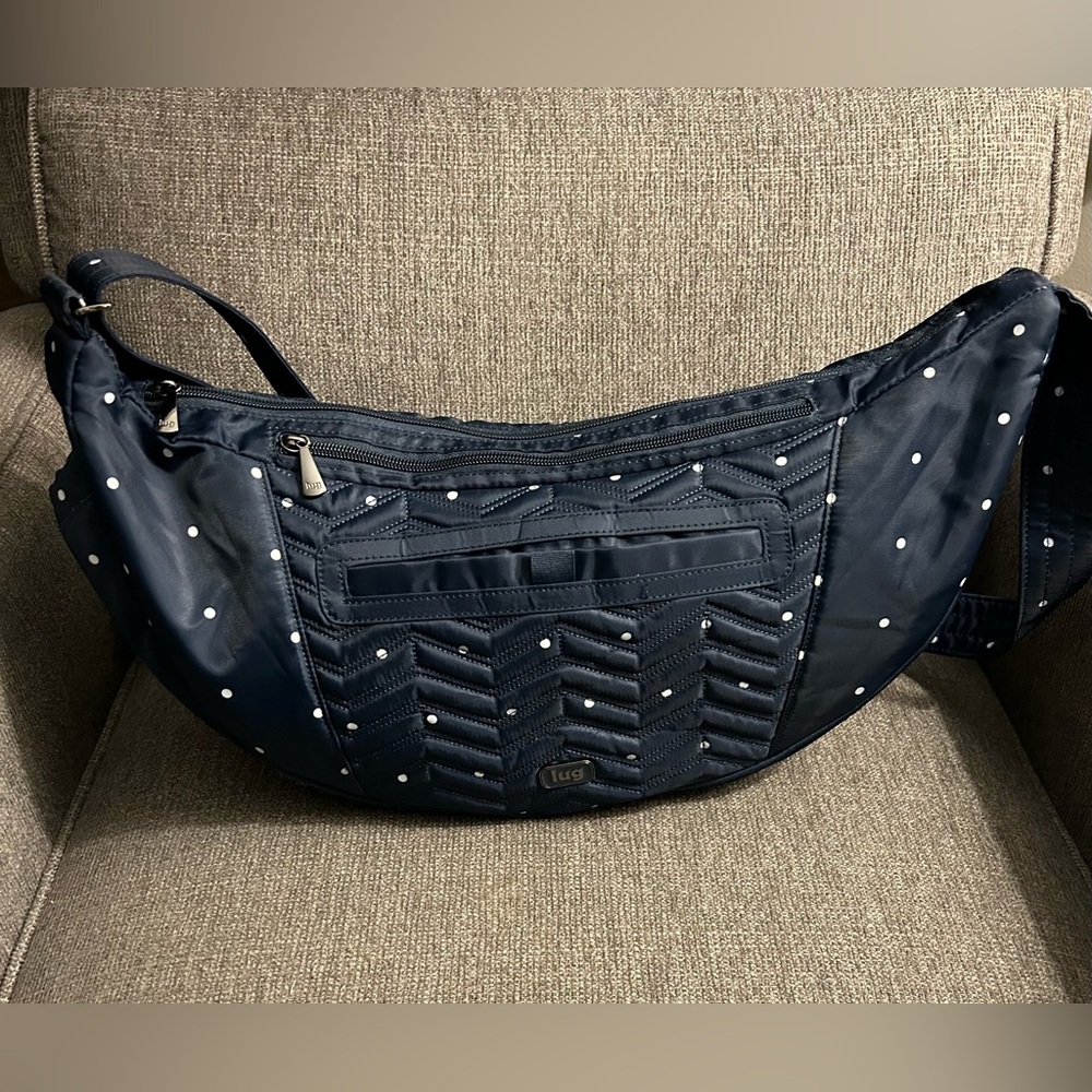 Boomerang Lug navy with white polka dots crossbody bag